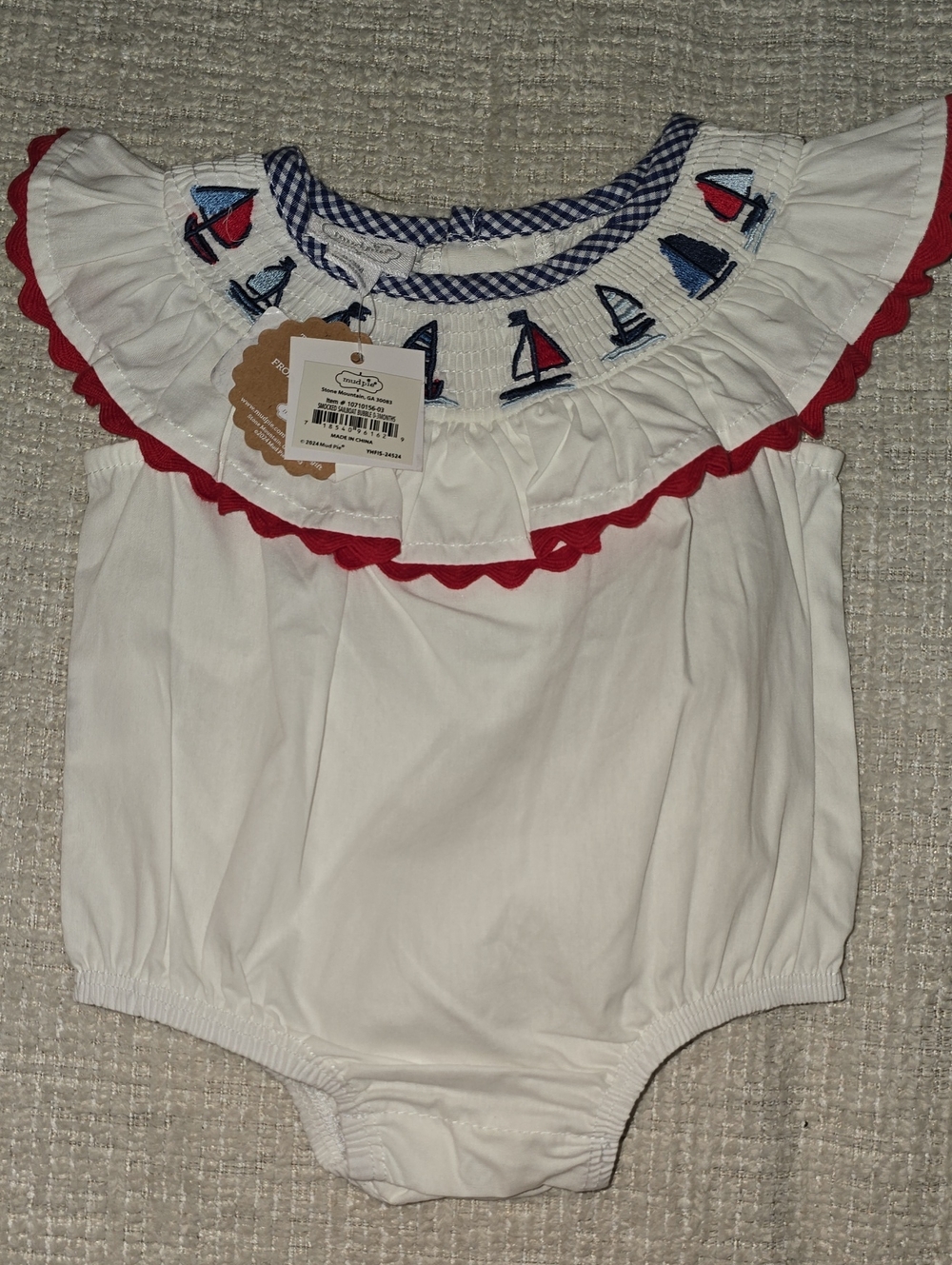 Mud Pie White Baby Romper with Red Trim and Blue Sailboat Smocking